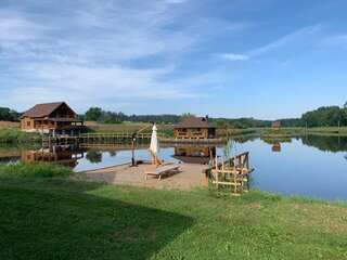 Фото Загородные дома GuestHouse on the Lake with Bathhouse 70 km from Kiev г. Makariv